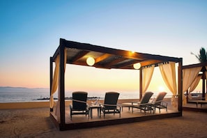 Private beach, beach cabanas, beach towels, beach massages