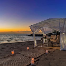 Private beach, beach cabanas, beach towels, beach massages