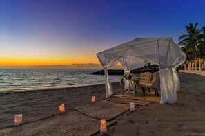 Private beach, beach cabanas, beach towels, beach massages