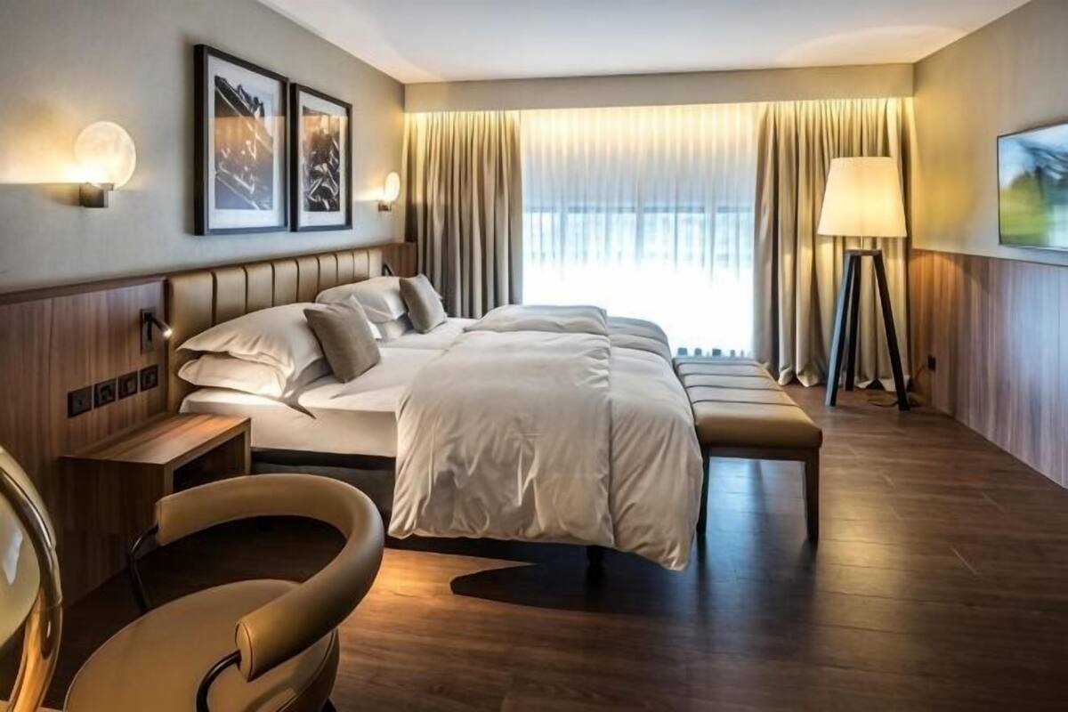 Hypo-allergenic bedding available, down comforters, in-room safe