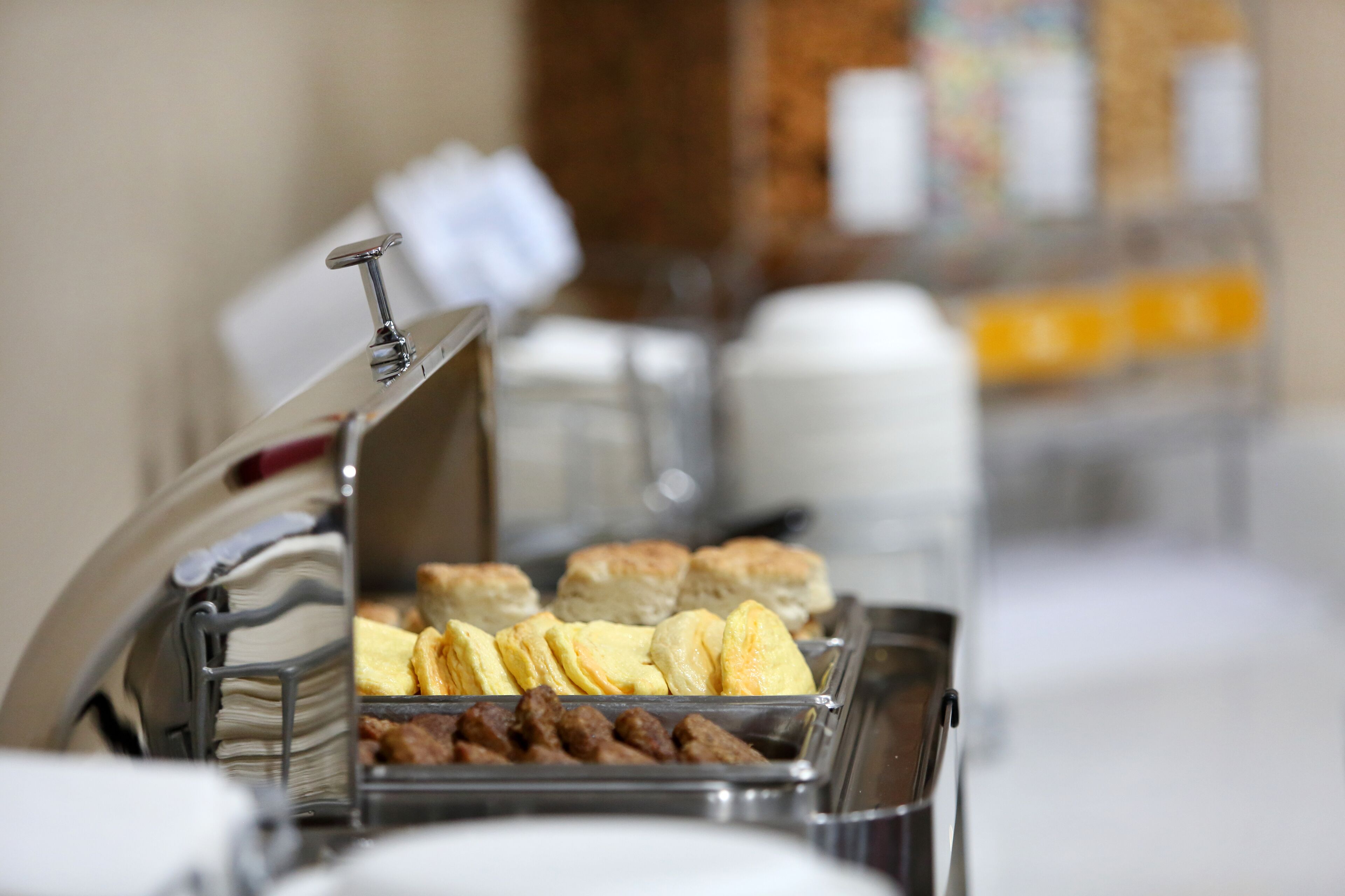 A buffet with various food items including pastries and meats.