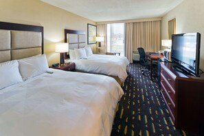 A hotel room with two beds, a television, a desk, and a chair. - Wyndham Chicago O'Hare (Des Plaines)