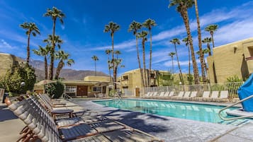 Outdoor pool, pool umbrellas, sun loungers