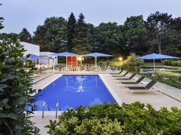 Seasonal outdoor pool, open 9:00 AM to 9:00 PM, pool loungers