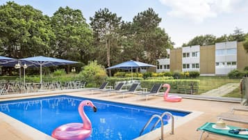 Seasonal outdoor pool, open 9:00 AM to 9:00 PM, pool loungers