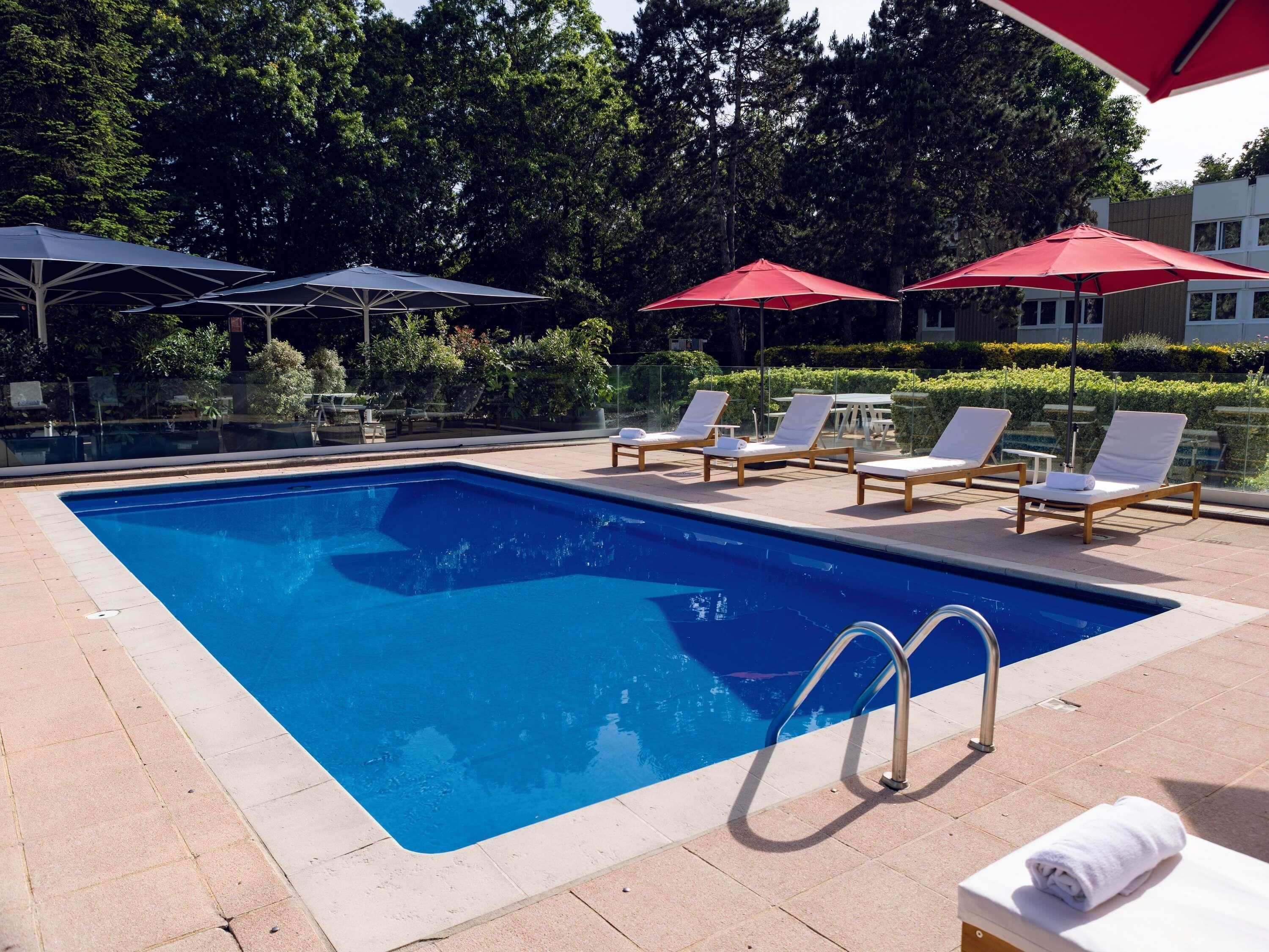 Seasonal outdoor pool, open 9:00 AM to 9:00 PM, pool loungers