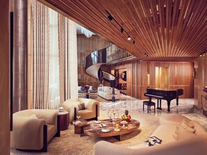 Prestige Duplex | Living area | 65-inch flat-screen TV with satellite channels, TV, Netflix