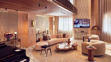 Prestige Duplex | Living area | 65-inch flat-screen TV with satellite channels, TV, Netflix