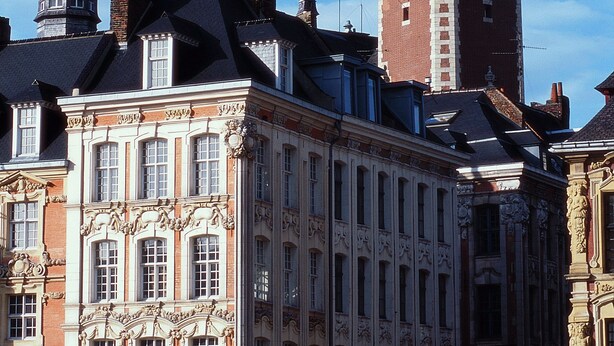 A historic building with a prominent clock tower and ornate architectural details. - Hotel ibis Lille Centre Gares (Lille)