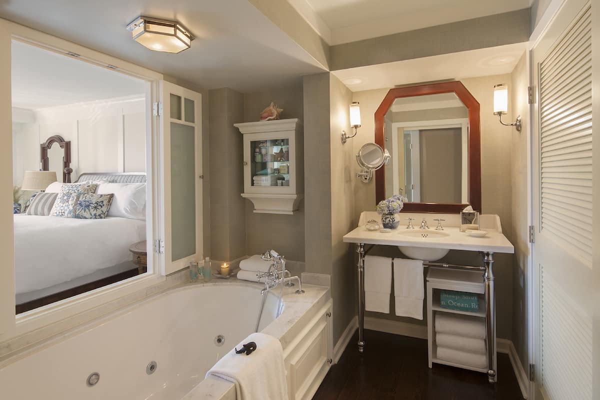 combined shower/bathtub, designer toiletries, hair dryer, bathrobes