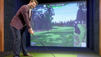 Golfers can practice their swing in a state-of-the-art golf simulation room.
