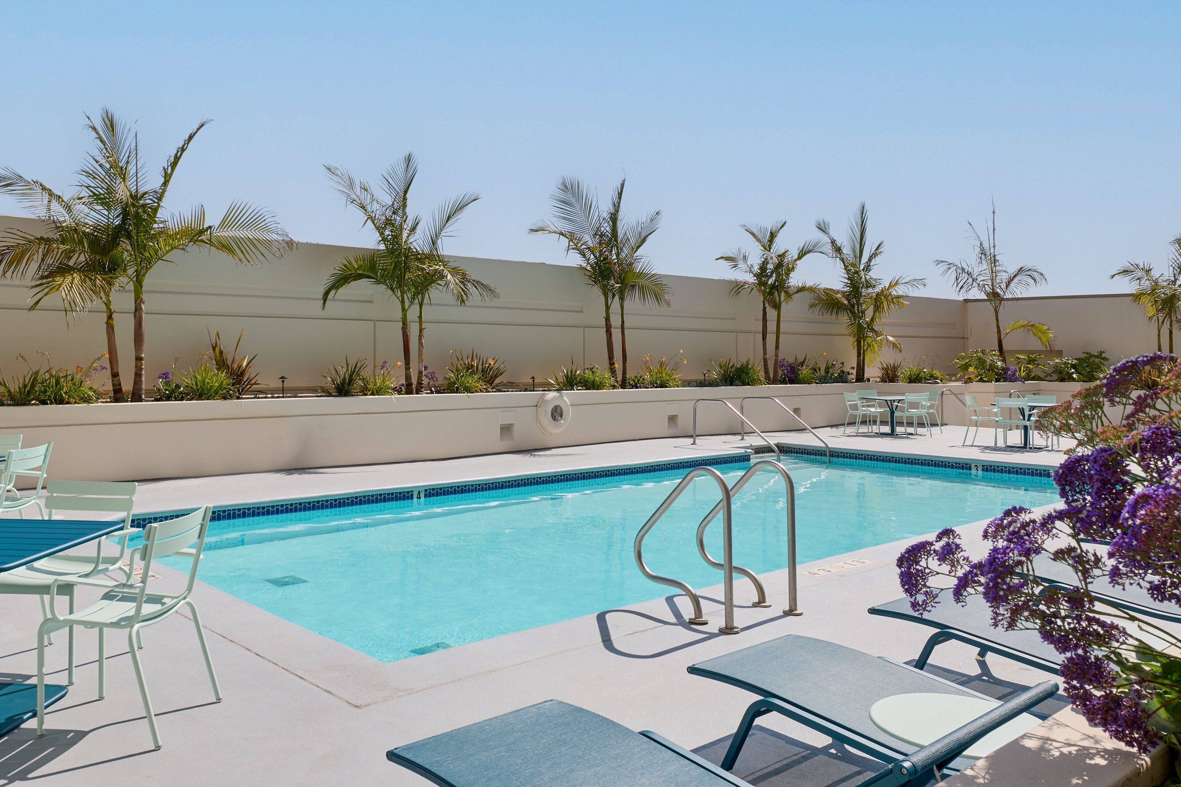 Outdoor pool, open 7:00 AM to 10:00 PM, sun loungers