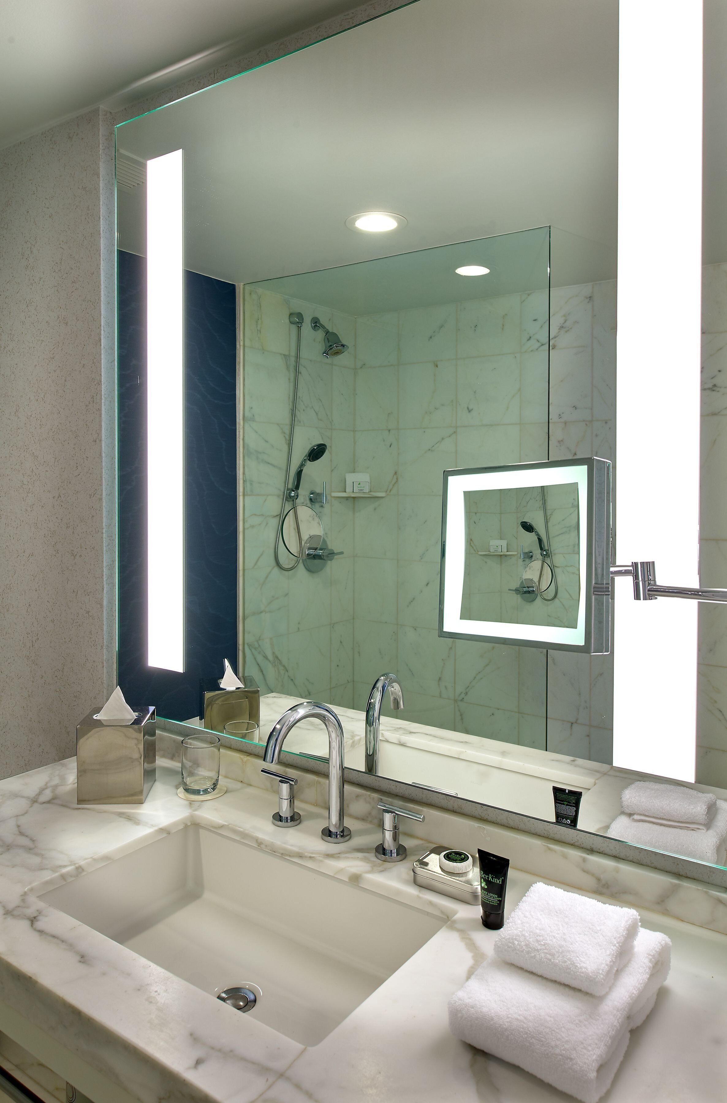 combined shower/bathtub, designer toiletries, hair dryer, bathrobes