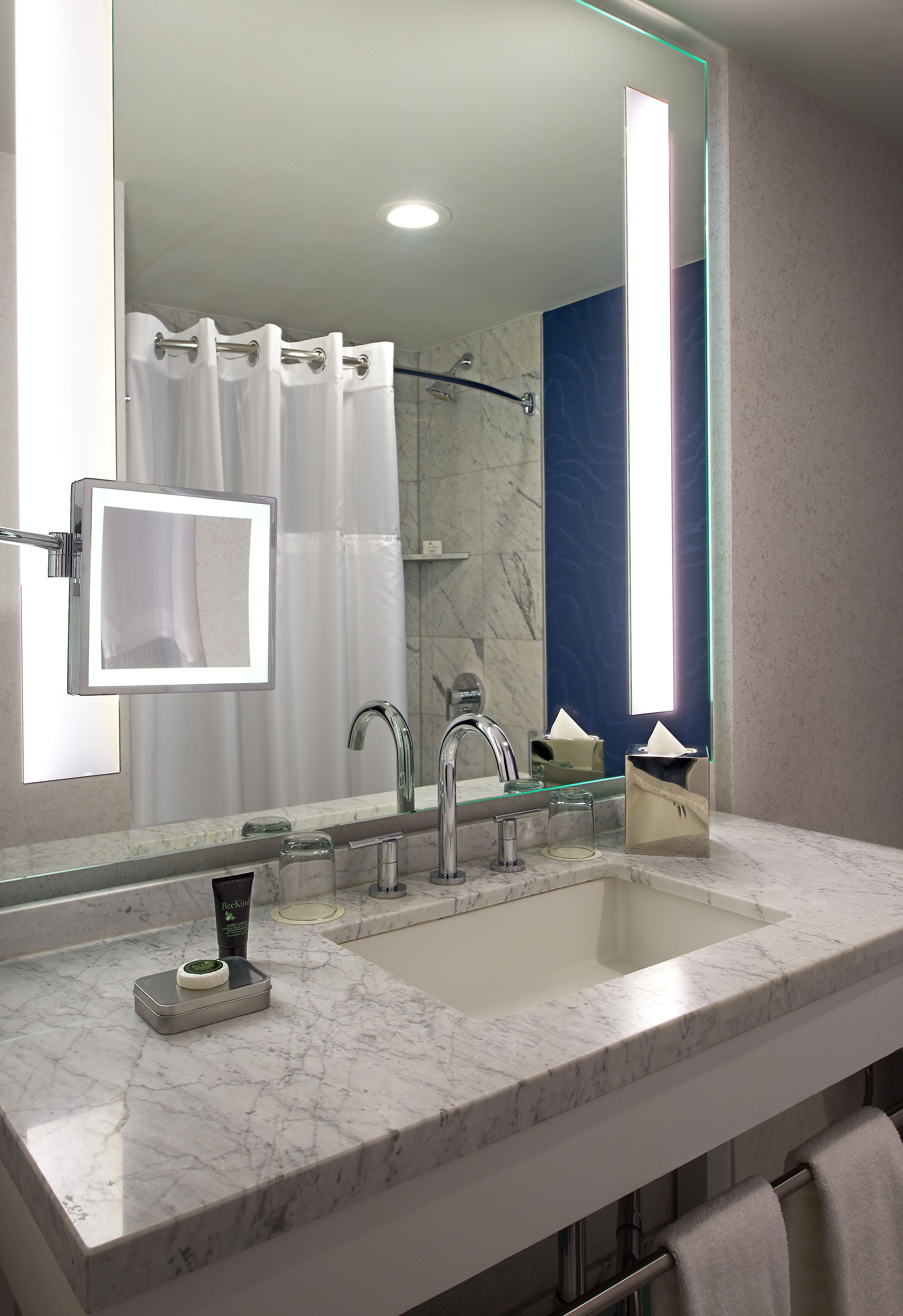 combined shower/bathtub, designer toiletries, hair dryer, bathrobes