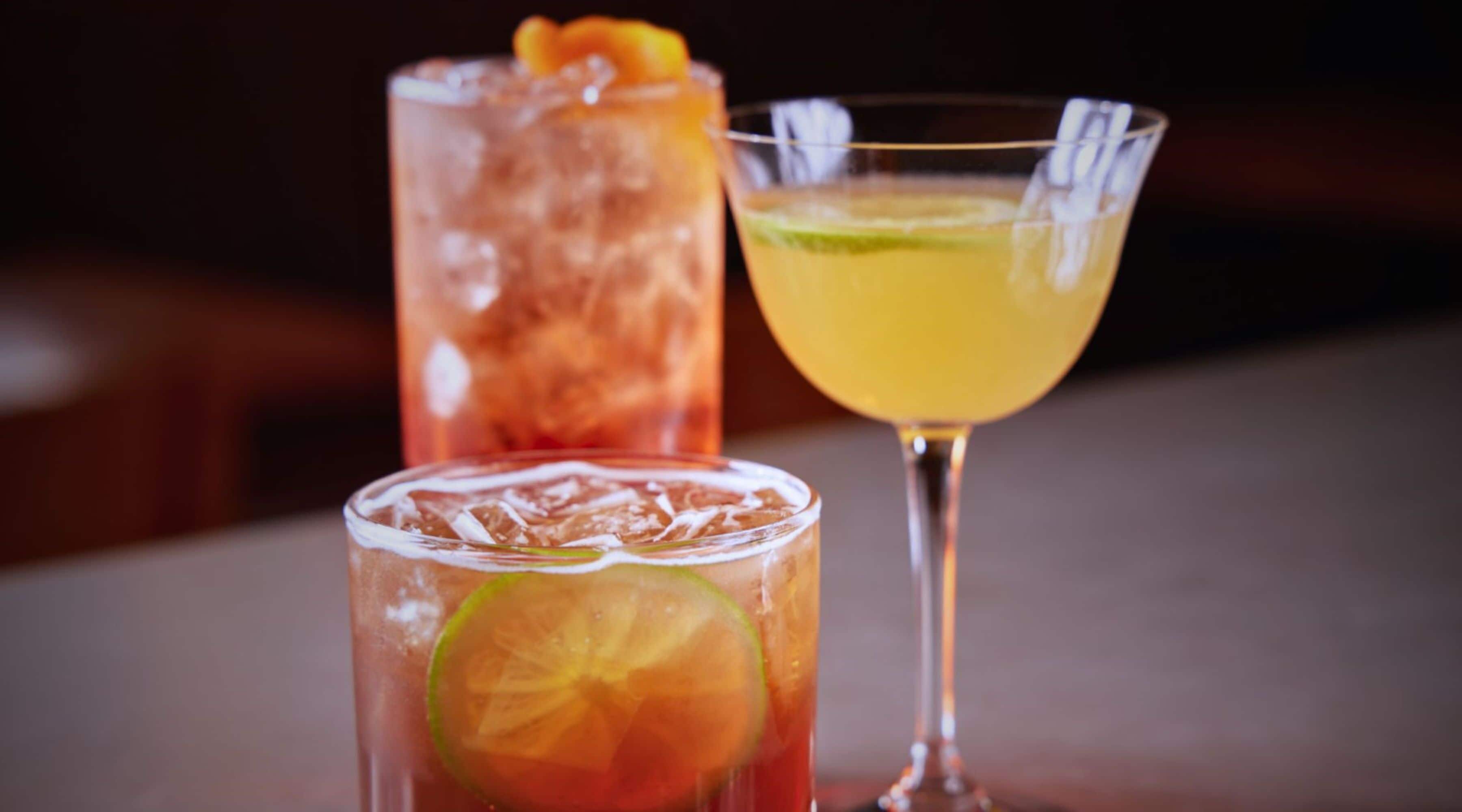 Three different types of drinks in glasses.
