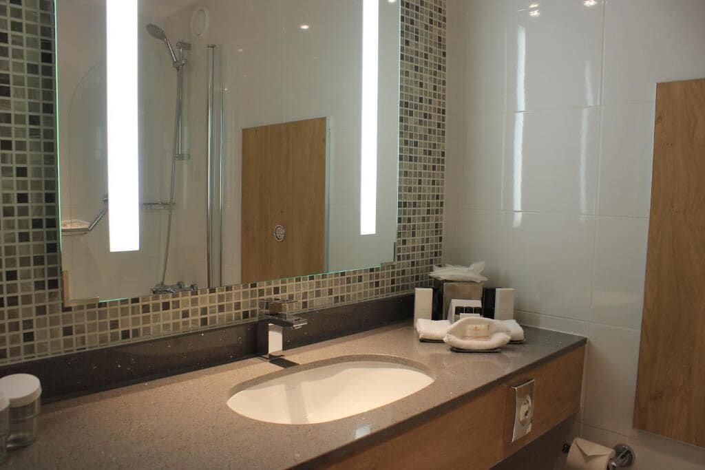 combined shower/bathtub, deep-soaking bathtub, eco-friendly toiletries