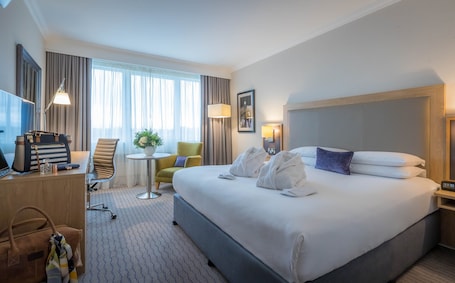 In-room safe, desk, laptop workspace, blackout drapes. Clayton Hotel Burlington Road