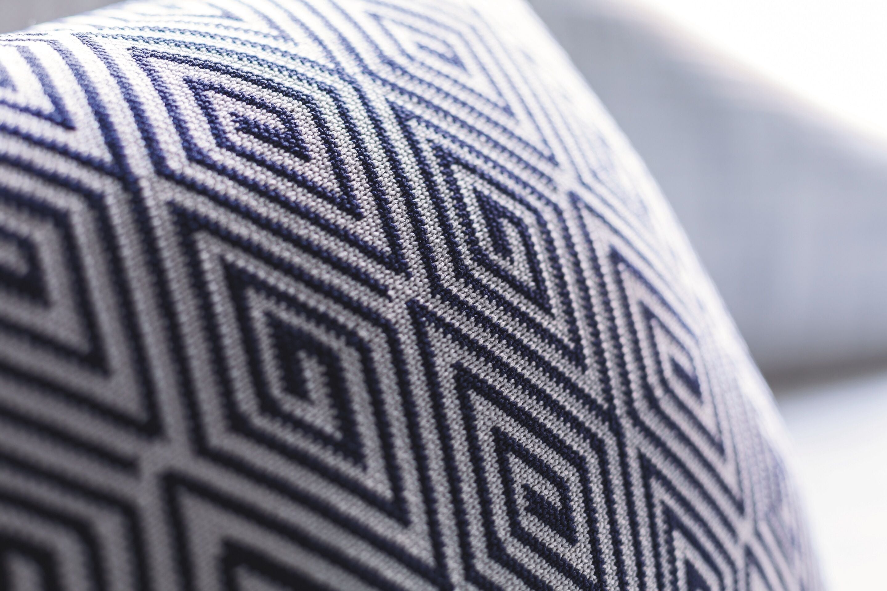 A close-up of a fabric with a geometric pattern.