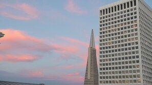 A modern building with a grid-like facade and a pointed spire. - The Ritz-Carlton, San Francisco (San Francisco)