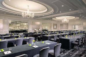 A conference room with rows of tables, chairs, and chandeliers. - The Ritz-Carlton, San Francisco (San Francisco)