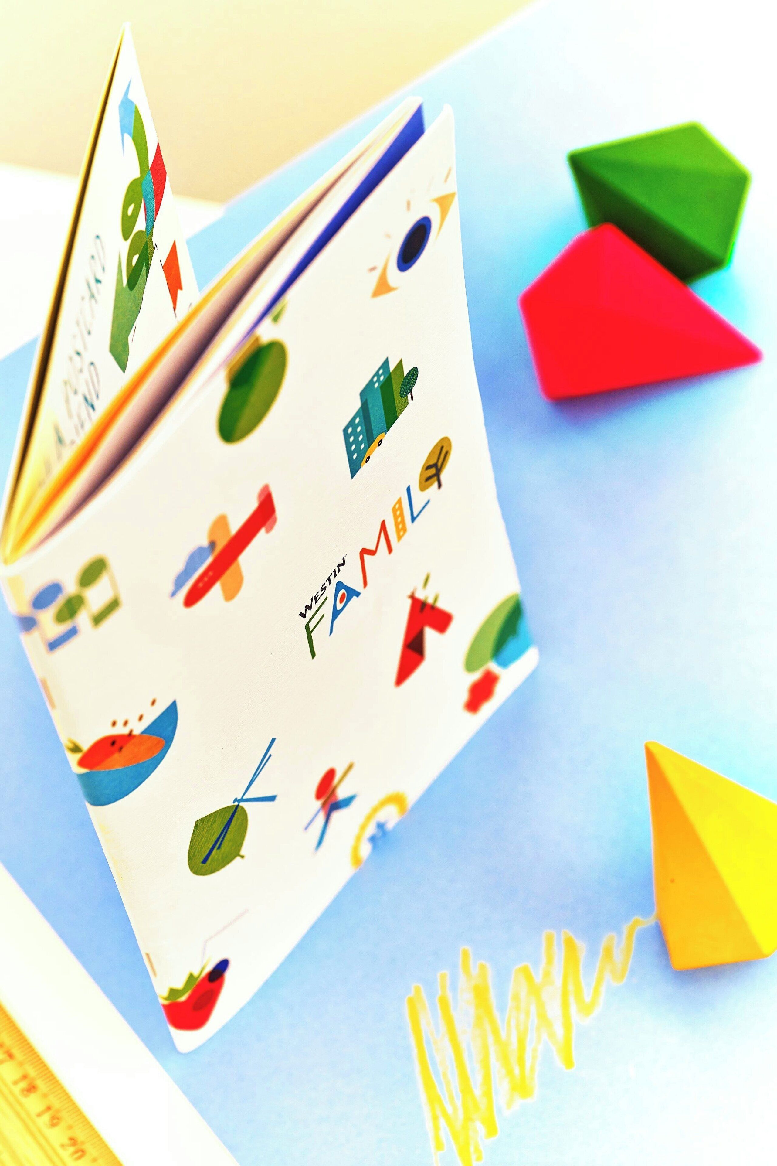 A book with colorful illustrations and the text "WESTIN FAMILY" on the cover.