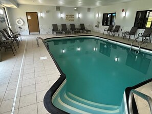 A swimming pool with lounge chairs, a lifeguard sign, and a door. - Best Western Forsyth - Decatur (Forsyth)