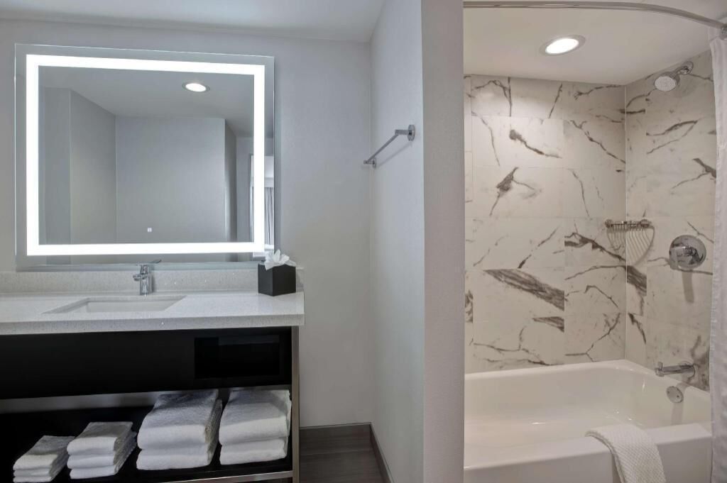 Shower, eco-friendly toiletries, hair dryer, towels