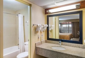 Enjoy a convenient bathroom with a shower, toilet, and sink.