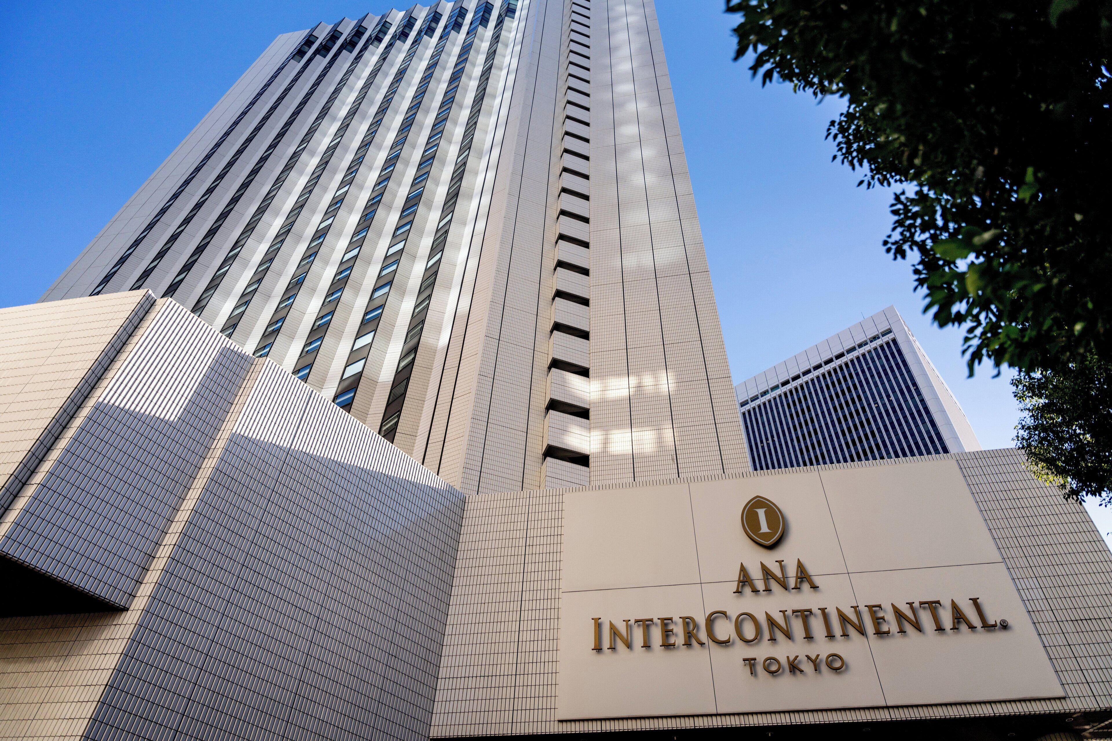A tall building with a sign reading "ANA Intercontinental Tokyo."