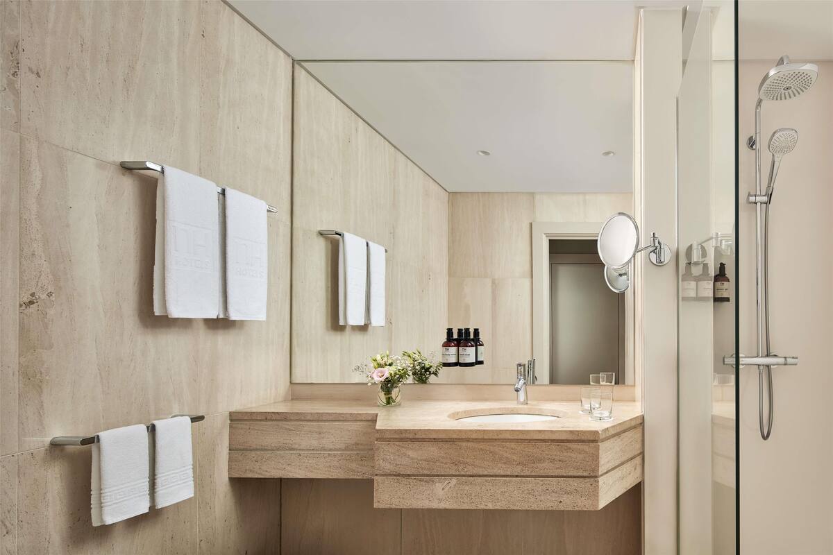 bathtub, eco-friendly toiletries, hair dryer, bidet