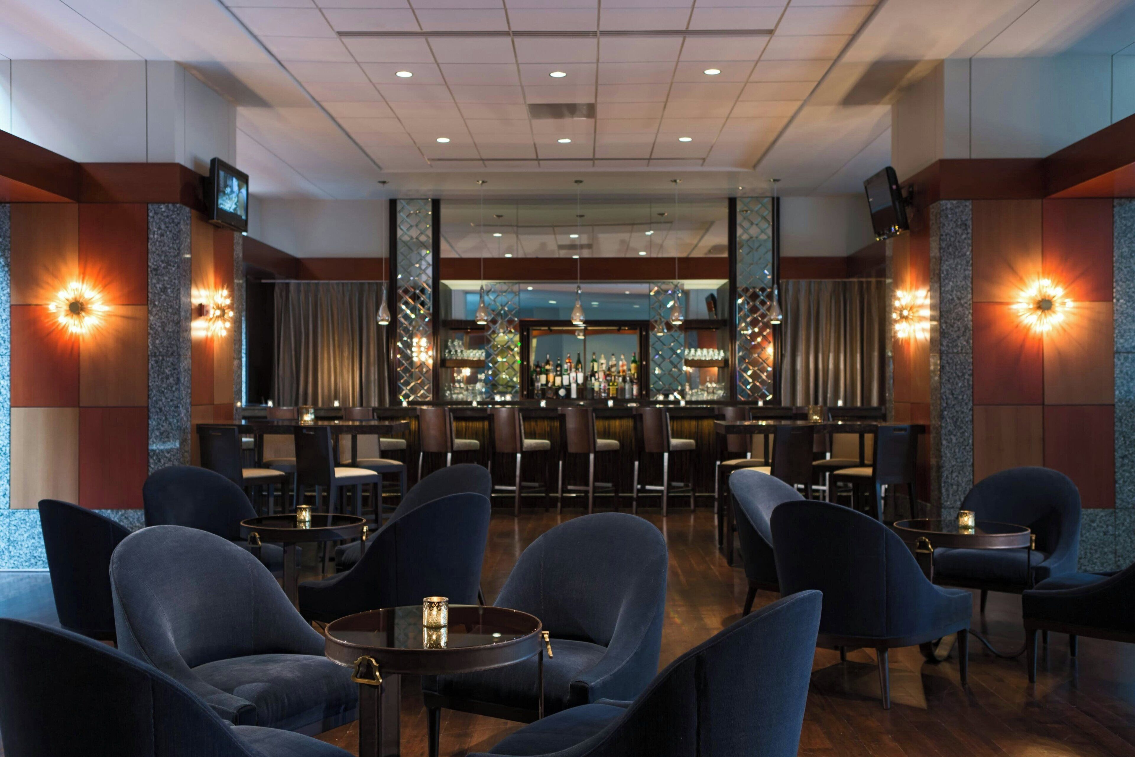 A bar area with seating and a bar counter.