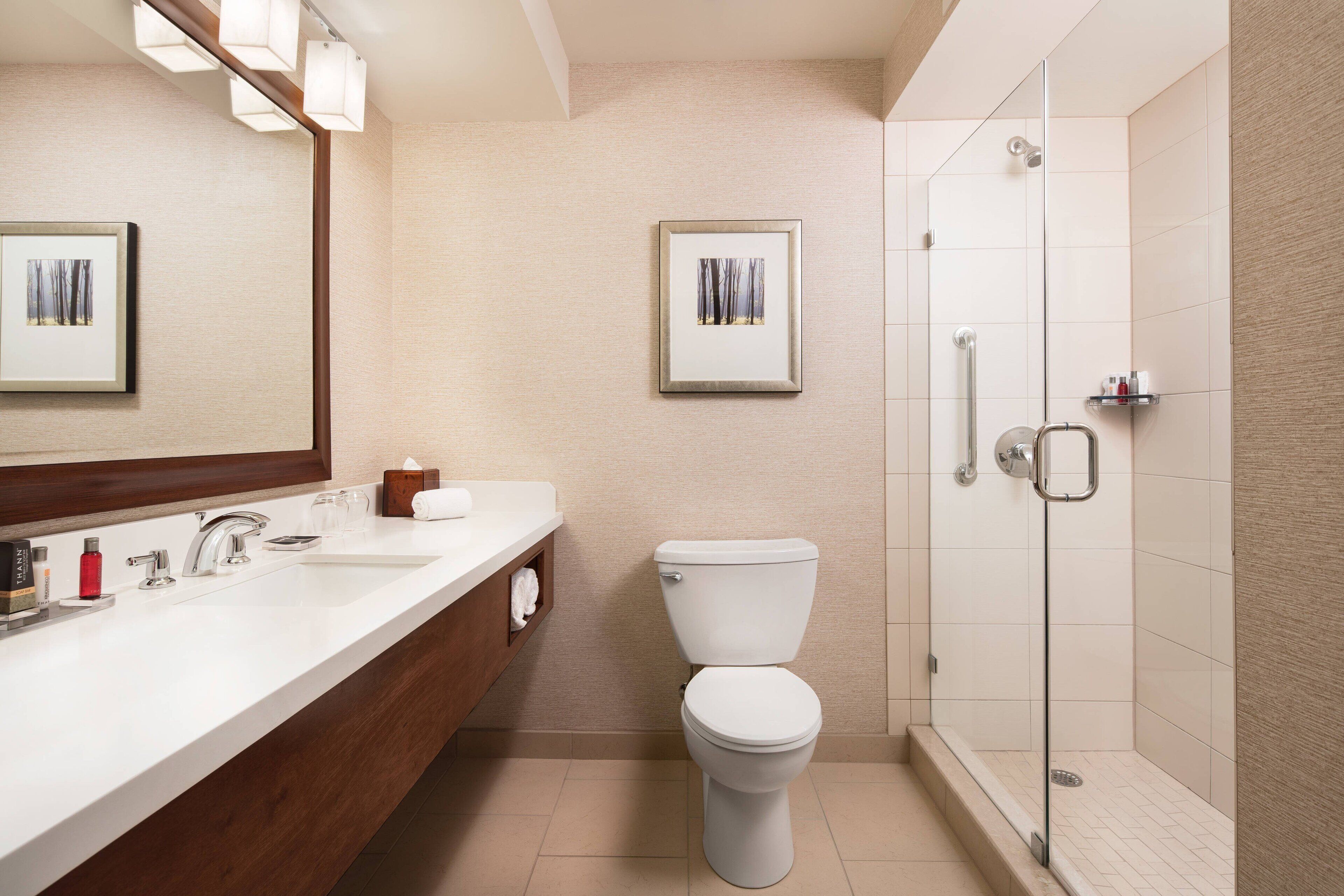 designer toiletries, hair dryer, bathrobes, towels