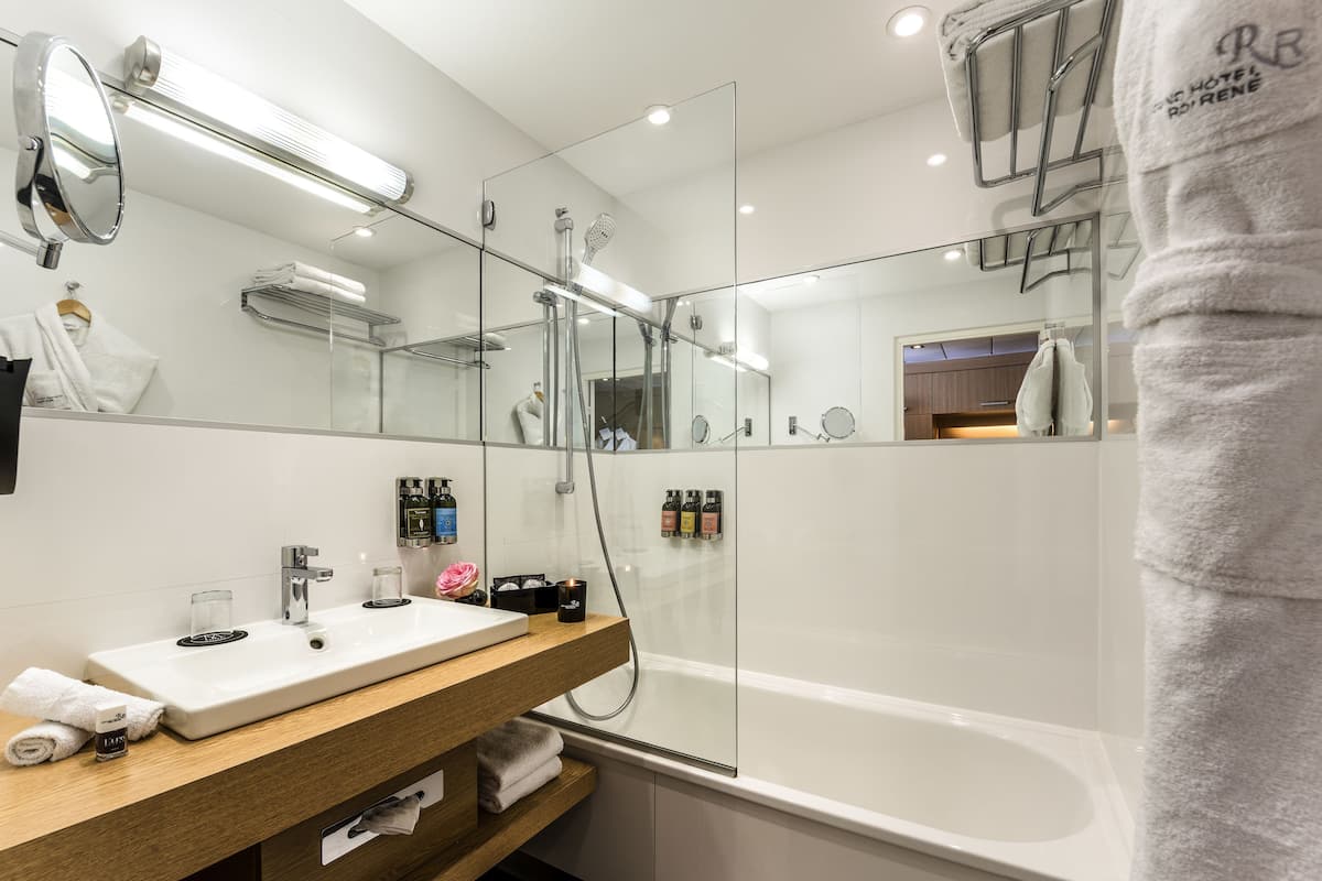 eco-friendly toiletries, hair dryer, bathrobes, slippers