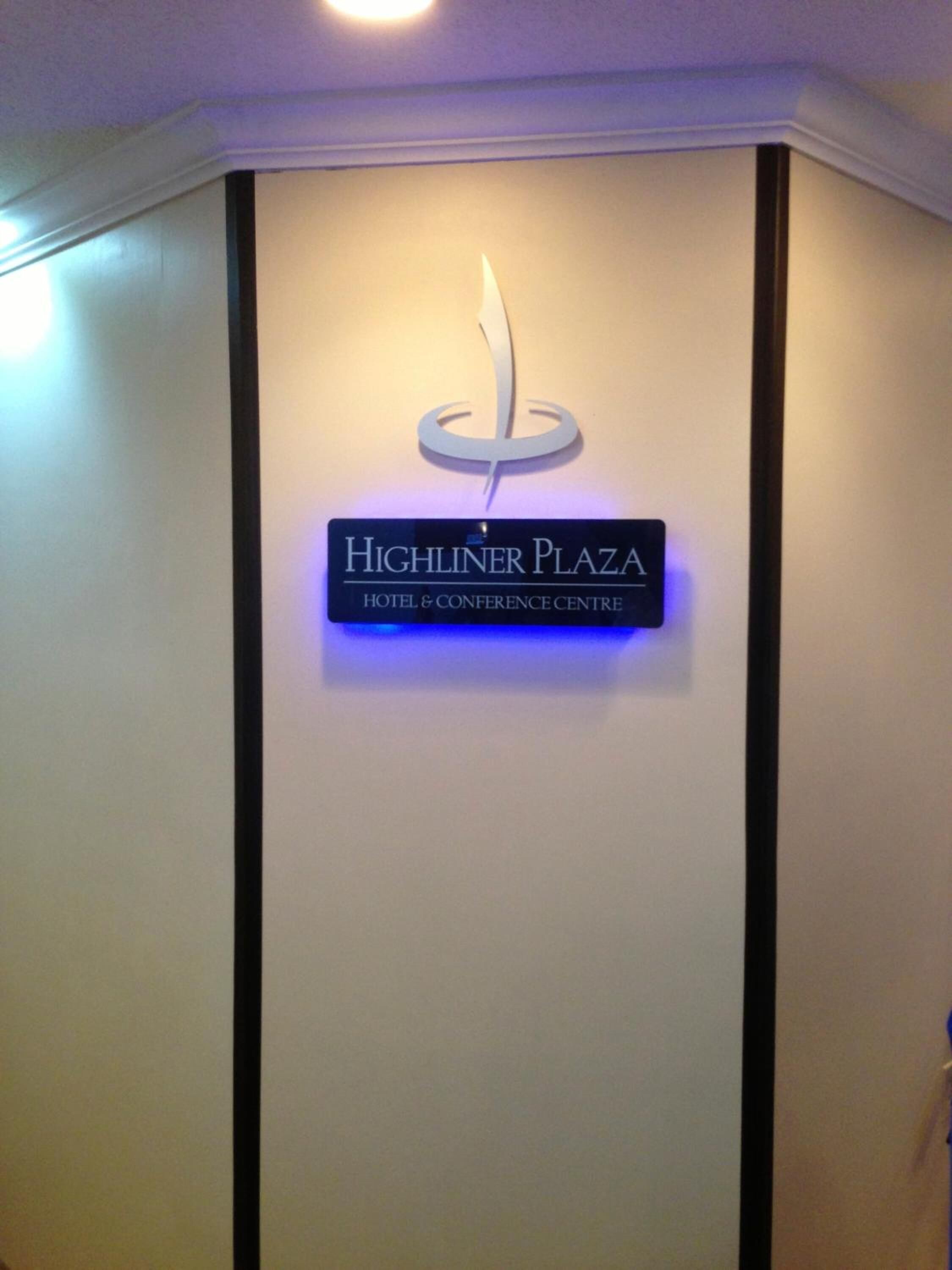 A sign for Highliner Plaza Hotel & Conference Centre.