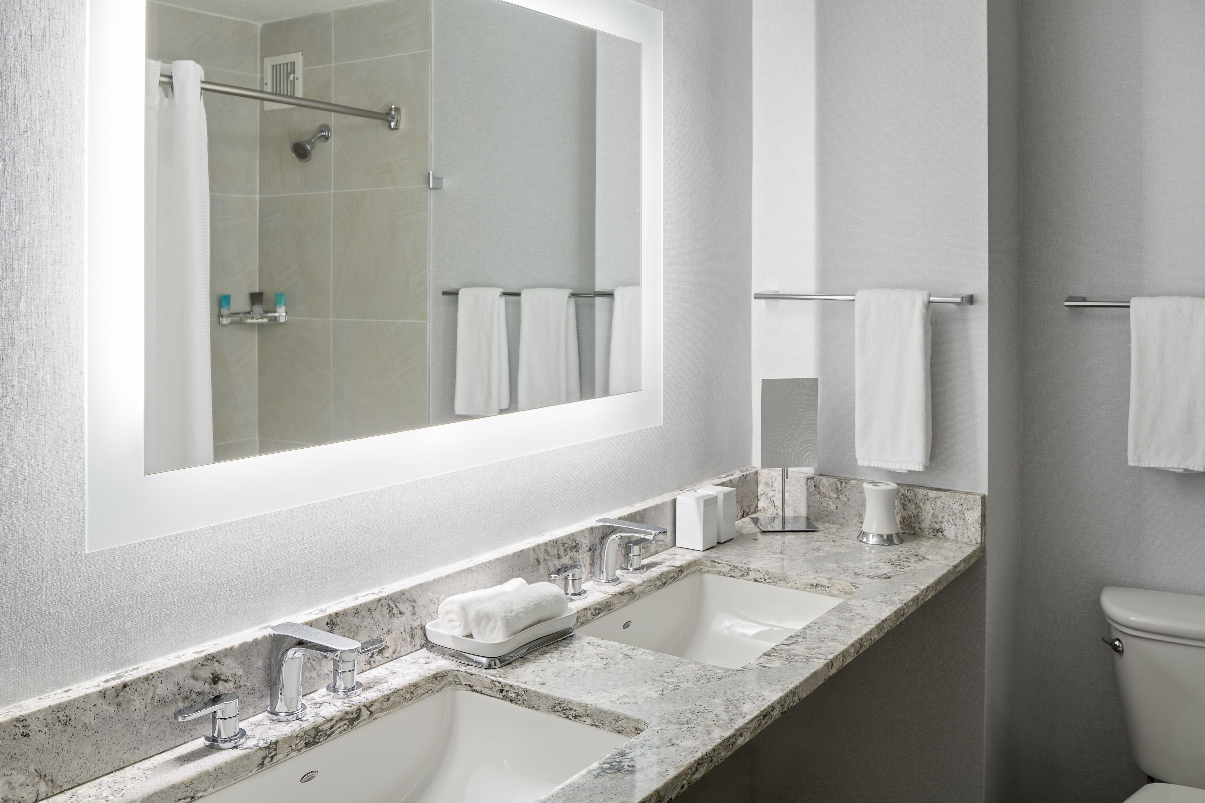 designer toiletries, hair dryer, towels, soap