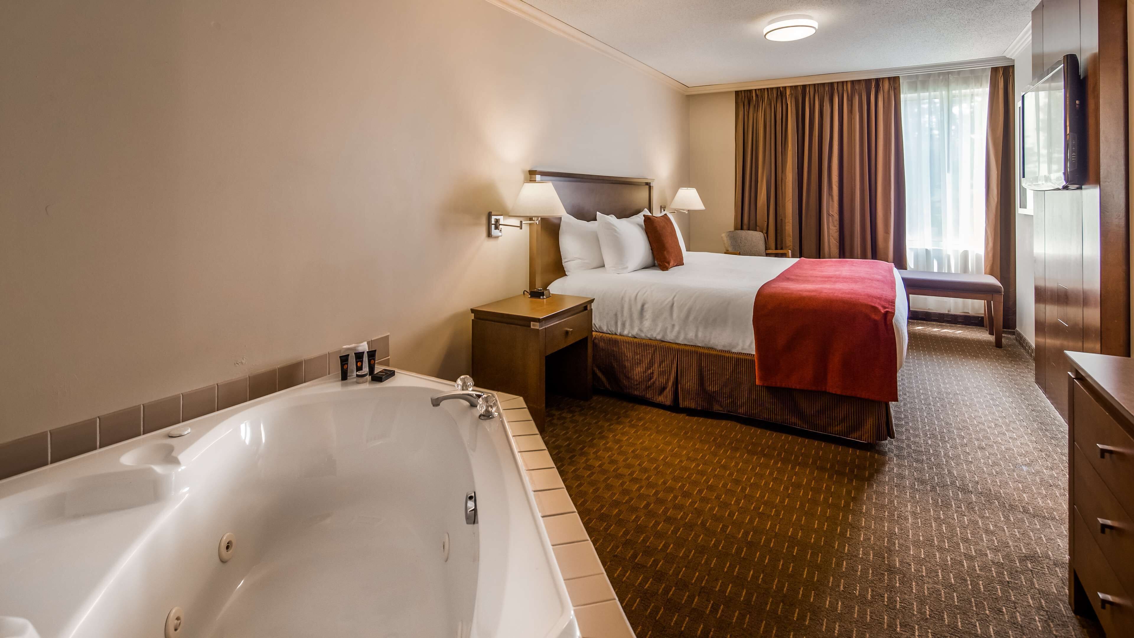 suite, 1 king bed, non smoking, jetted tub (with sofabed) | laptop workspace, blackout curtains, iron/ironing board, free wifi