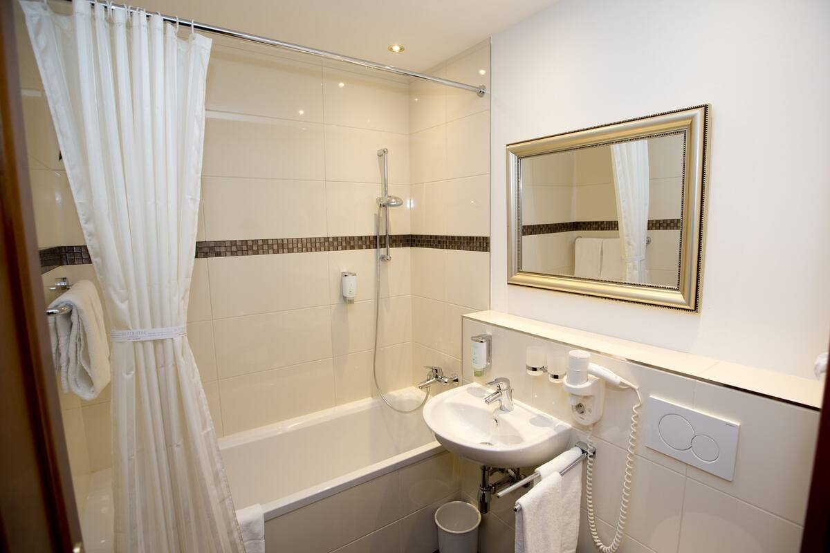 superior double room | bathroom | free toiletries, hair dryer, towels