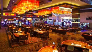 A casino with multiple gaming tables and slot machines. - Golden Nugget Biloxi (Biloxi)