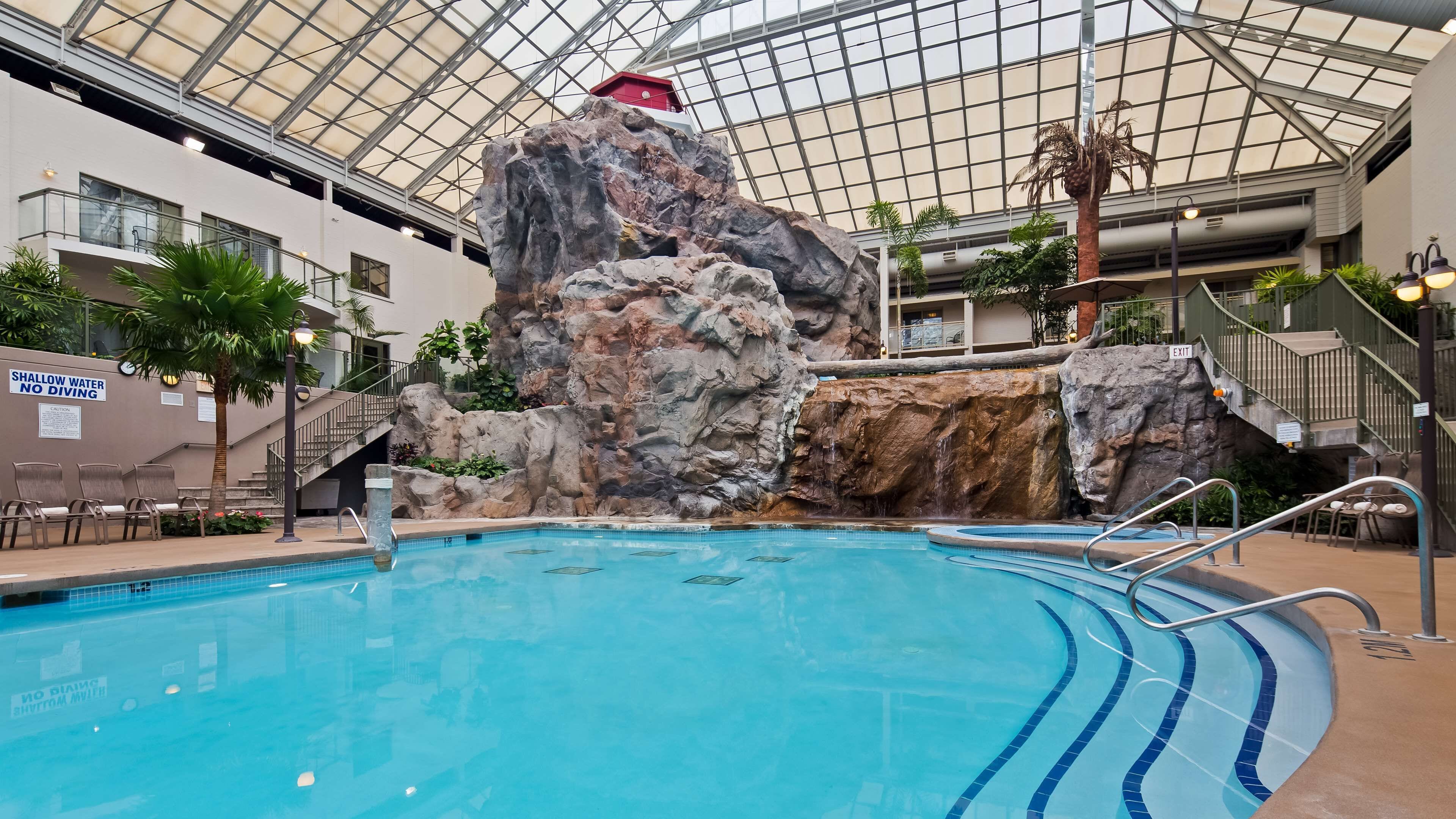 Indoor pool, open 8:00 AM to 10:00 PM, pool loungers