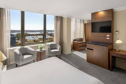 Deluxe Room, 1 King Bed, Harbour View | In-room safe, desk, iron/ironing board, free cots/infant beds