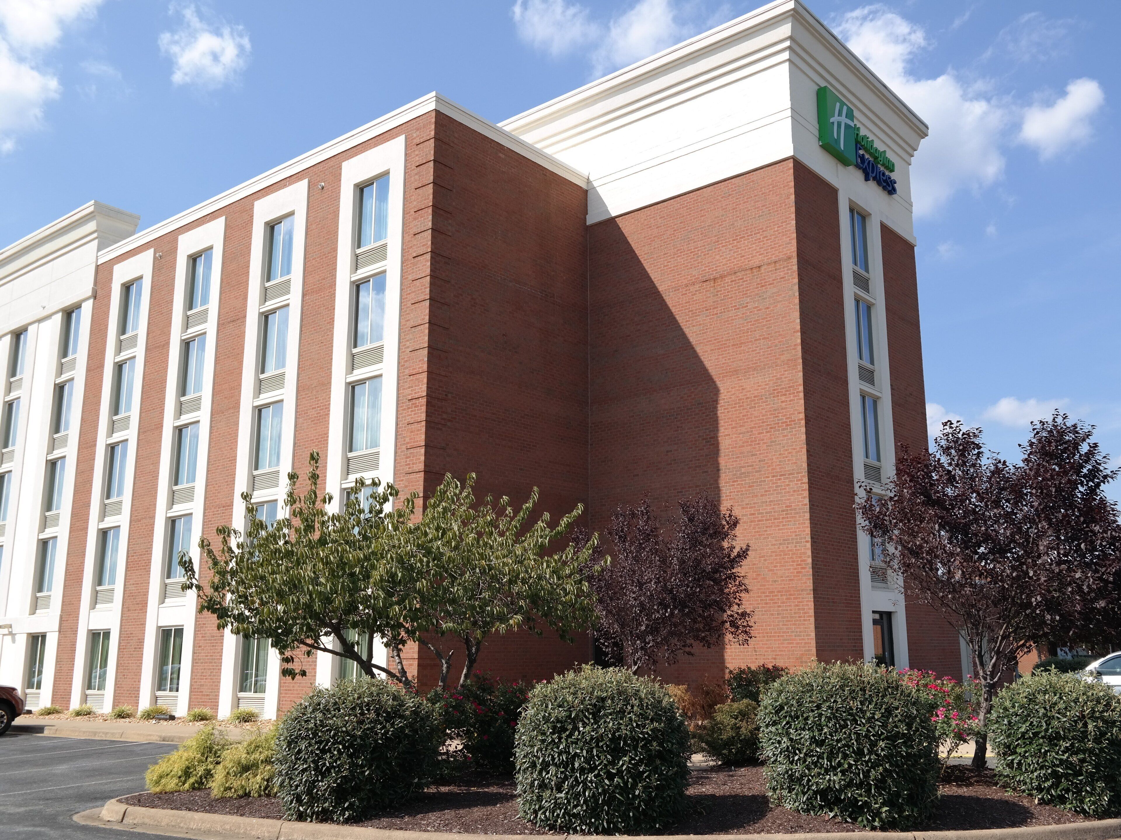 A brick building with a sign for 'Holiday Inn Express.'