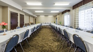 A conference room with a long table, chairs, and a carpeted floor. - Days Inn by Wyndham Yadkinville (Yadkinville)