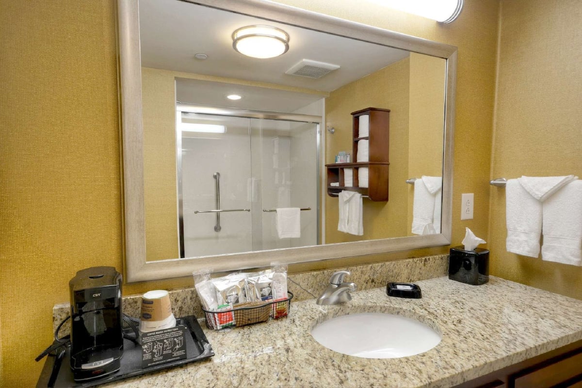 one large king studio suite | bathroom | hair dryer, towels