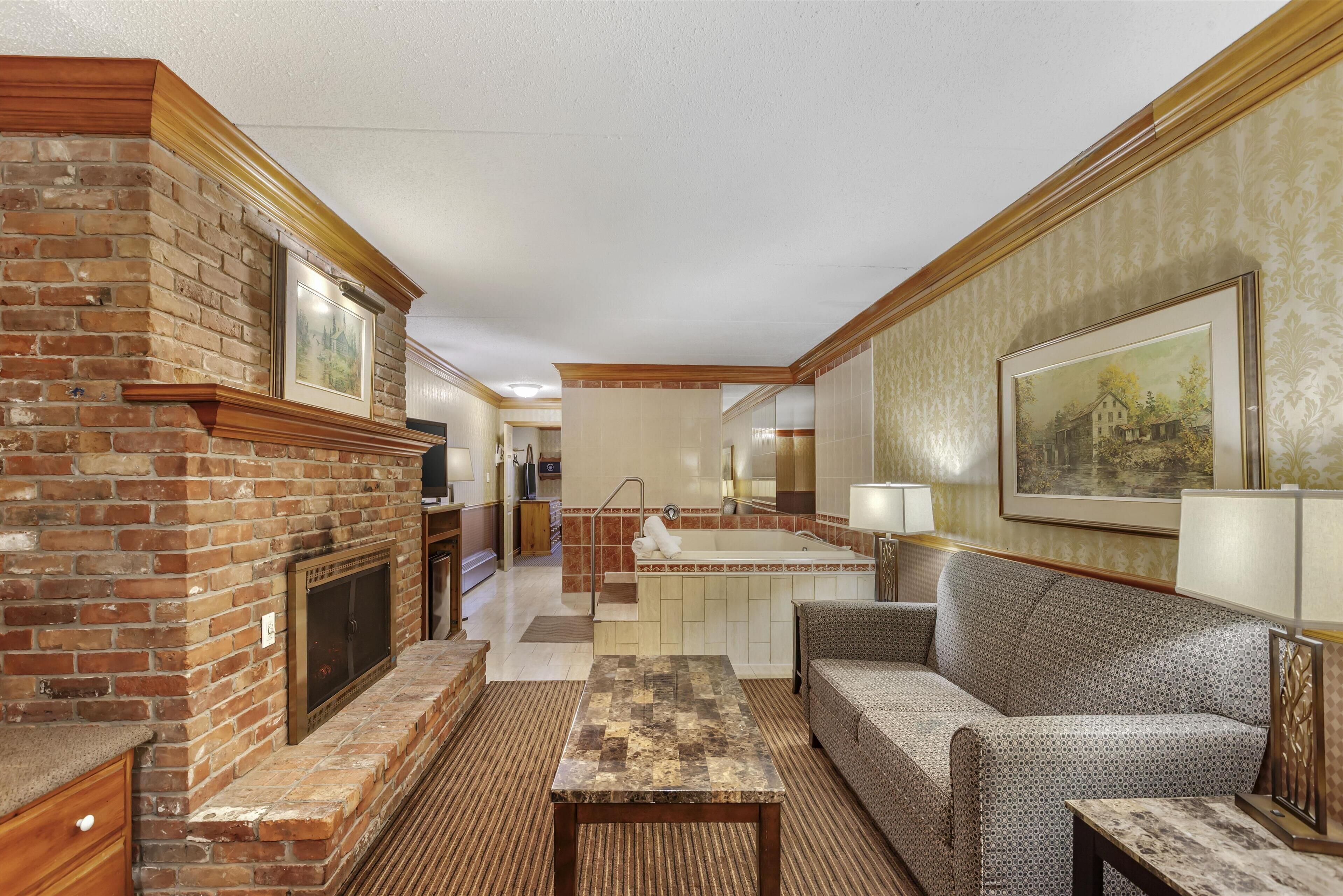 fireside whirlpool suite, 1 king bed, non smoking, jetted tub, fireplace | 1 bedroom, premium bedding, pillow-top beds, in-room safe