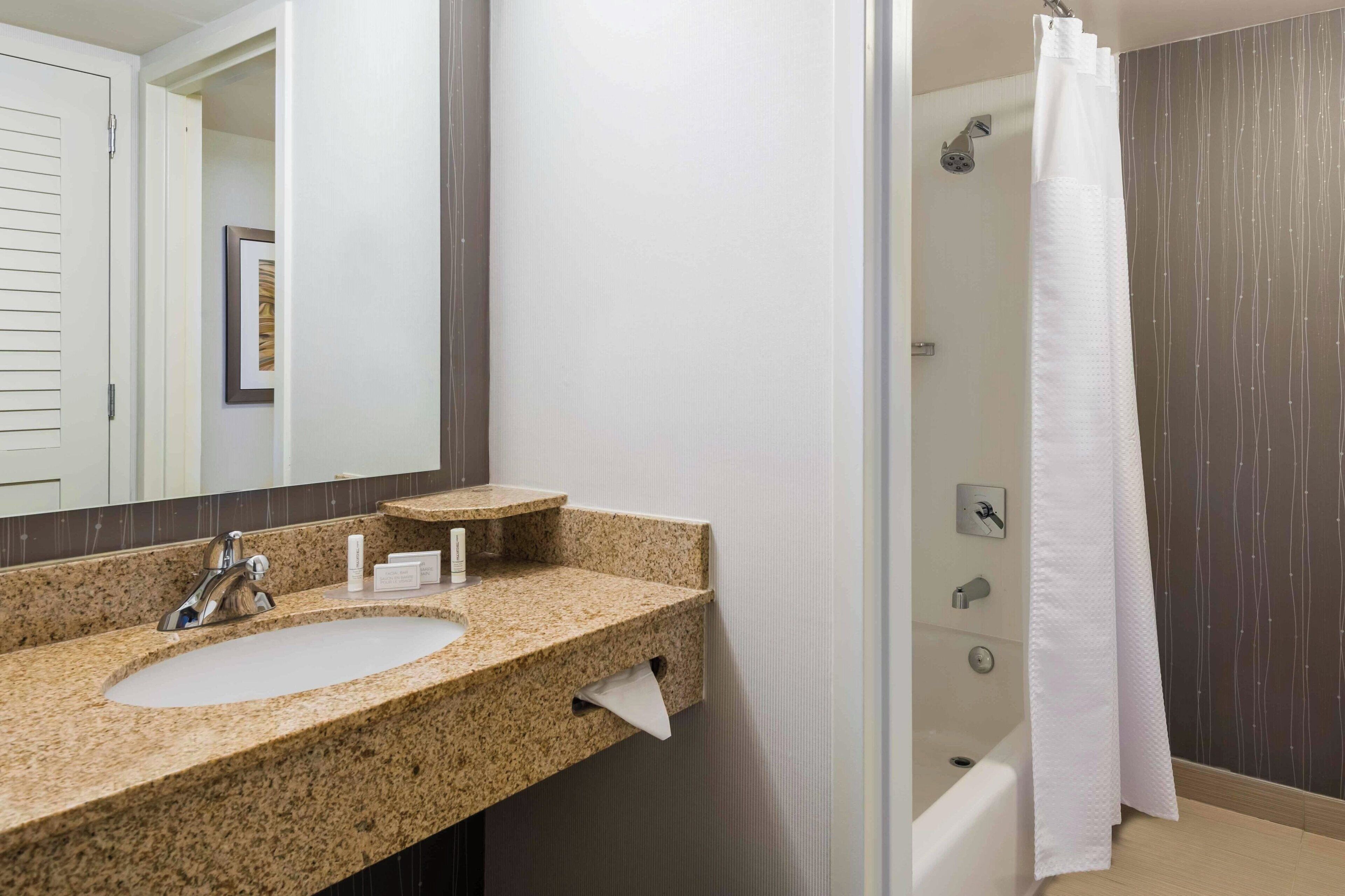 combined shower/bathtub, free toiletries, hair dryer, towels