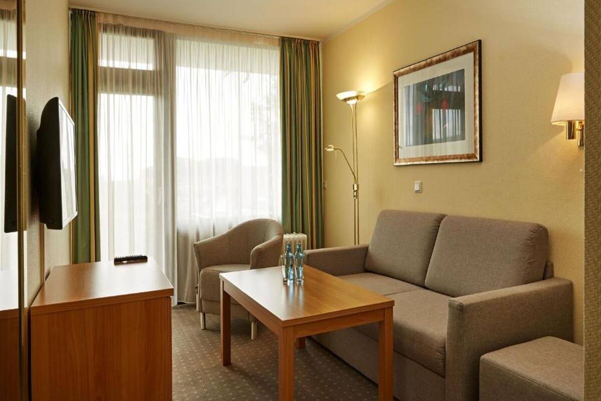 Family Room | Desk, blackout drapes, iron/ironing board (on request), cribs (free)