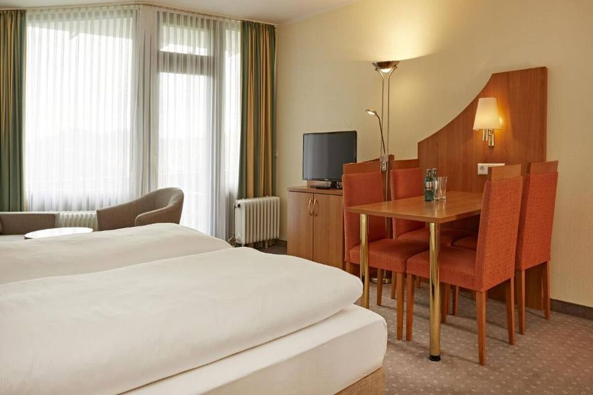 Standard Double Room | Desk, blackout drapes, iron/ironing board (on request), cribs (free)