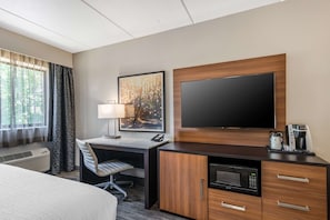 Premium bedding, desk, laptop workspace, iron/ironing board