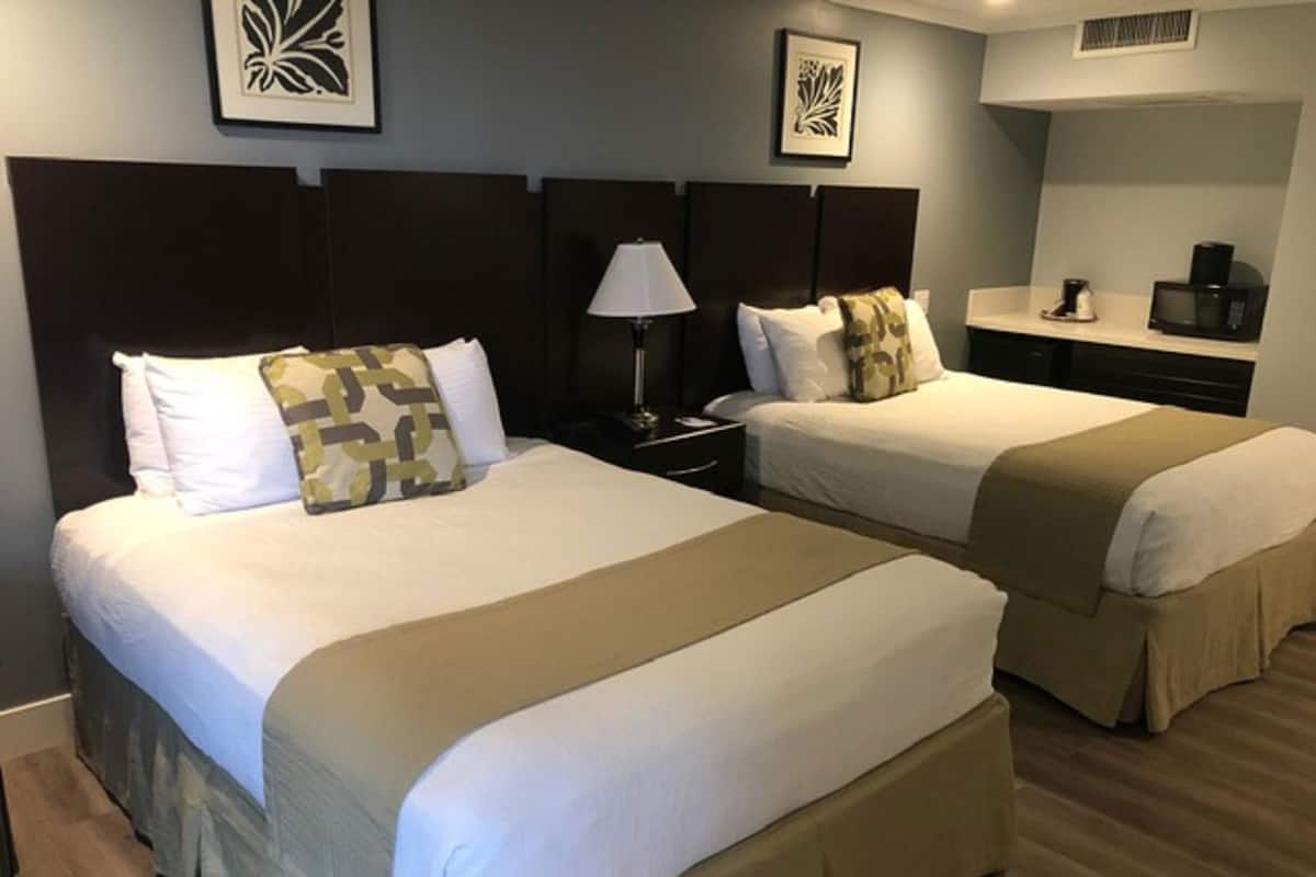 Luxe beddengoed, pillowtop-bedden, een kluis op de kamer