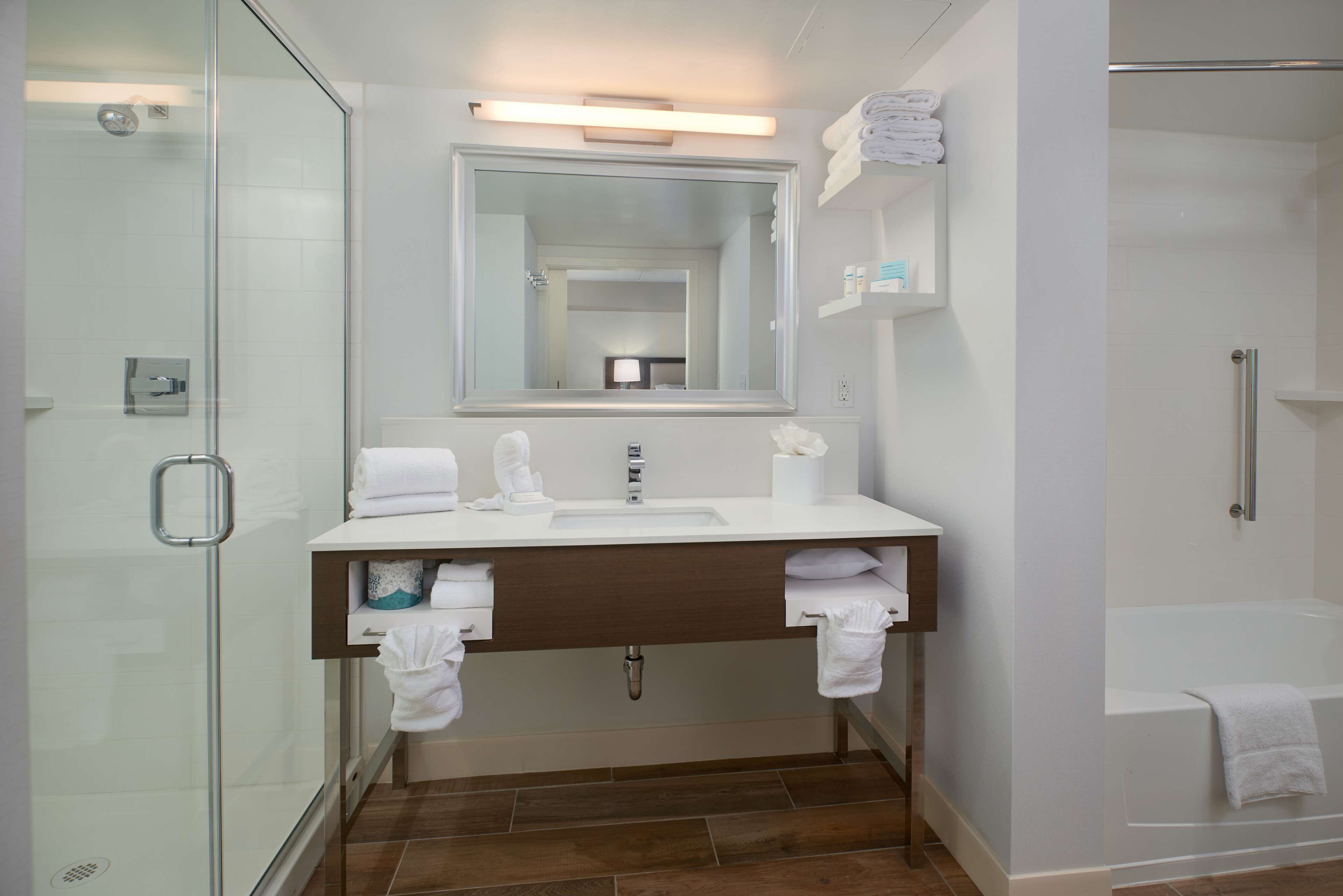 suite, 1 king bed, refrigerator & microwave (wet bar) | bathroom | combined shower/bathtub, free toiletries, towels